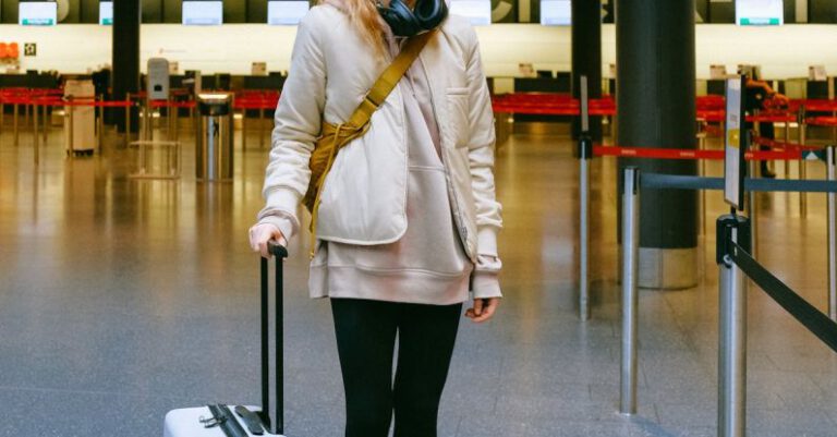 Travel Bans - Woman Wearing Face Mask at Airport