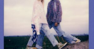 Gap Years - Couple Standing over Gap in Rock