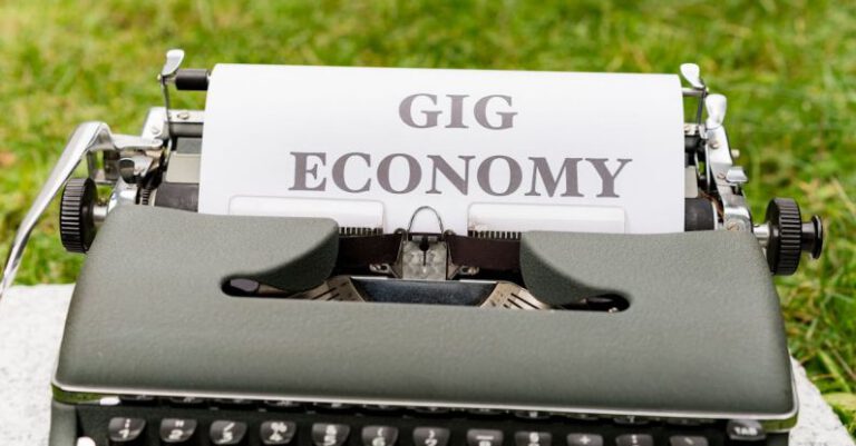 Gig Economy - A typewriter with the word gig economy written on it